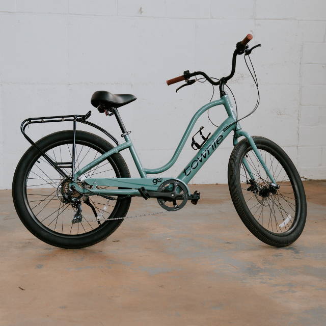 a teal Electra Townie electric city bike