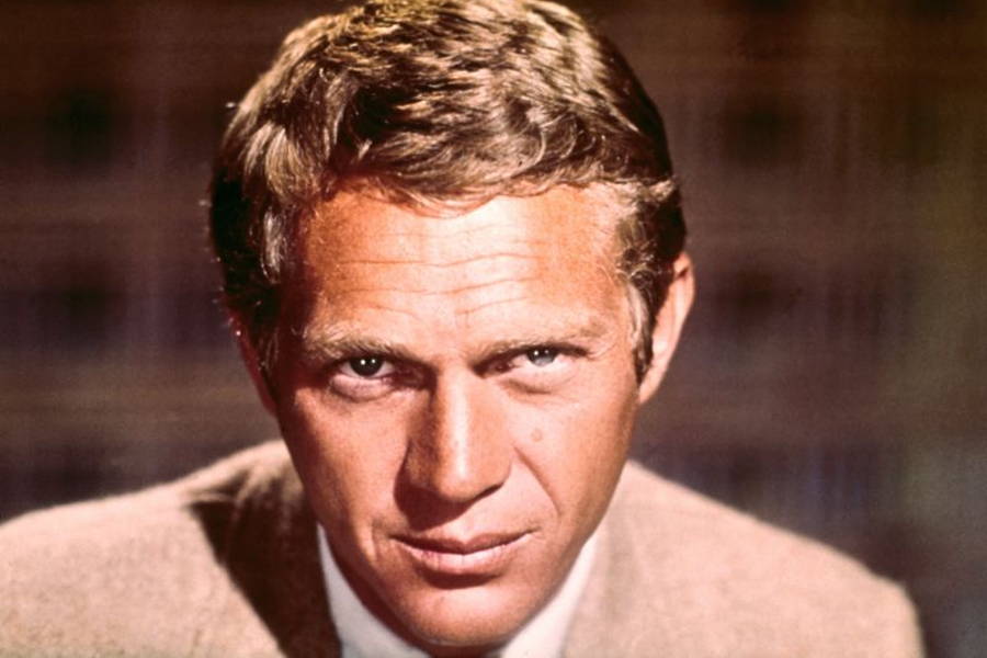 Image may contain: Steve McQueen, Face, Head, Person, Photography, Portrait, Adult, Blonde, Hair, Happy, and Smile