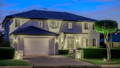 Outdoor wall lighting highlighting modern facade in Rouse Hill home by Havit