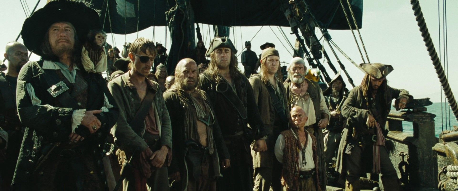 The pirates of the movie series all lined up ready for battle.