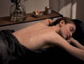 woman enjoying a body scrub treatment