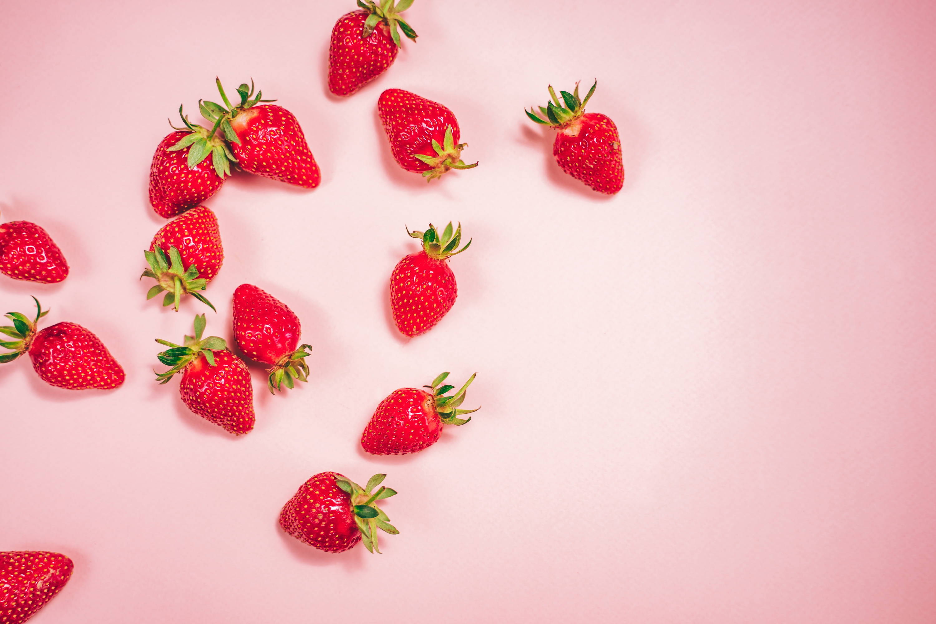 Strawberries on pink background