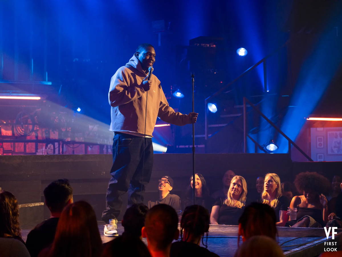 Image may contain: Michael Che, Justin Credible, Ryan Scott Oliver, Concert, Crowd, Person, Stage, Lighting, and Adult