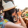Woman taking a photo on an outdoor event.