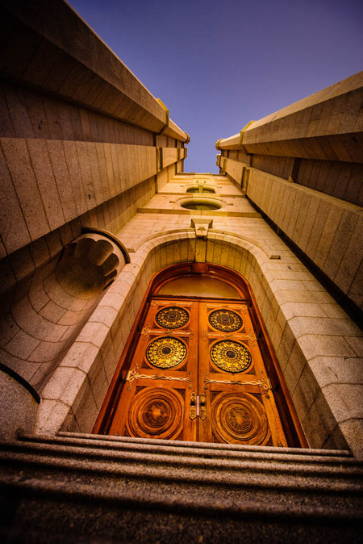 Photo of the Salt Lake Temple doors angled up toward the sky.