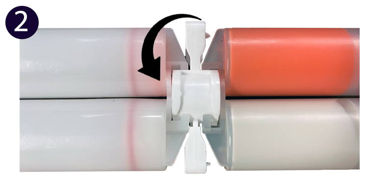 Picture of confirming the two cartridges are firmly pressed together and turn the Ribbon Holder to lock in the tow cartridges.