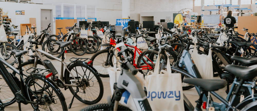 a collection of electric bikes at an upway upcenter