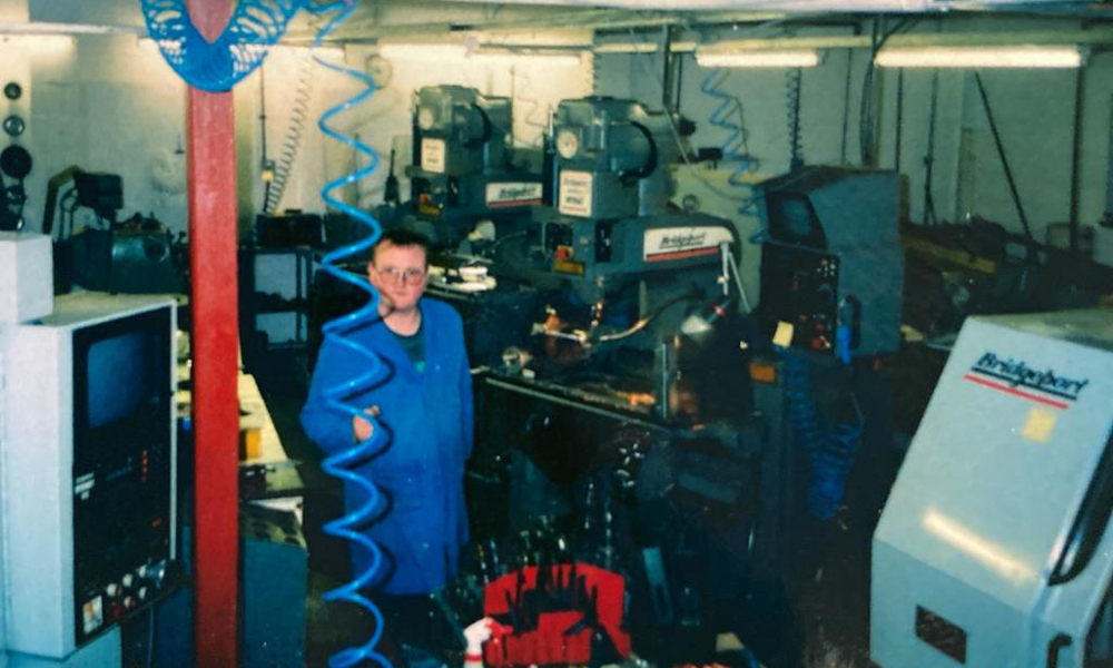 A young boy amongst engineering equipment