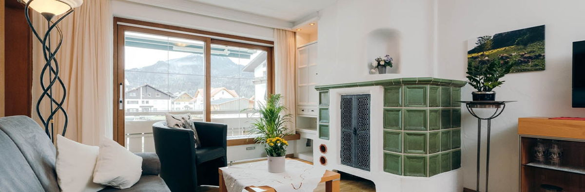 Ferienwohnung mit Kachelofen für gemütliche Winterabende im Allgäu.