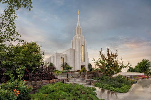 Twin Falls Temple surrounded by lush greenery. 