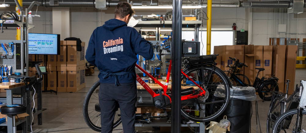 Upway mechanic at repair stand in LA UpCenter