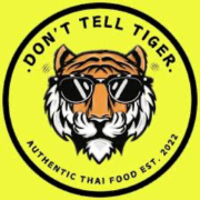 Don't Tell Tiger Cafe and Thai Restaurant logo