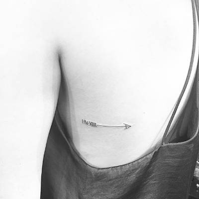 arrow back tattoo