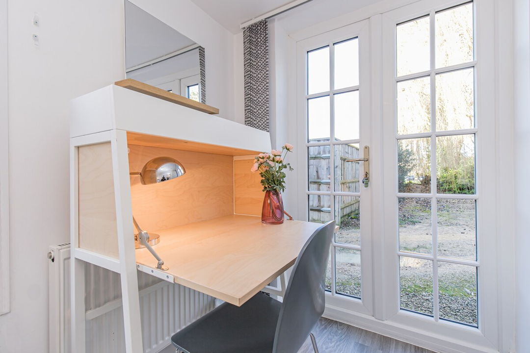 Dedicated workspace next to full height windows