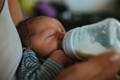 Baby Being Feed a Bottle