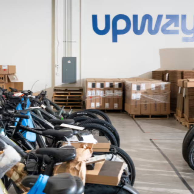 a line of bikes in the Upwaay warehouse