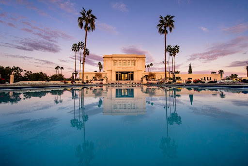 Close up photo of the Mesa Temple reflection pool with the temple in the background.