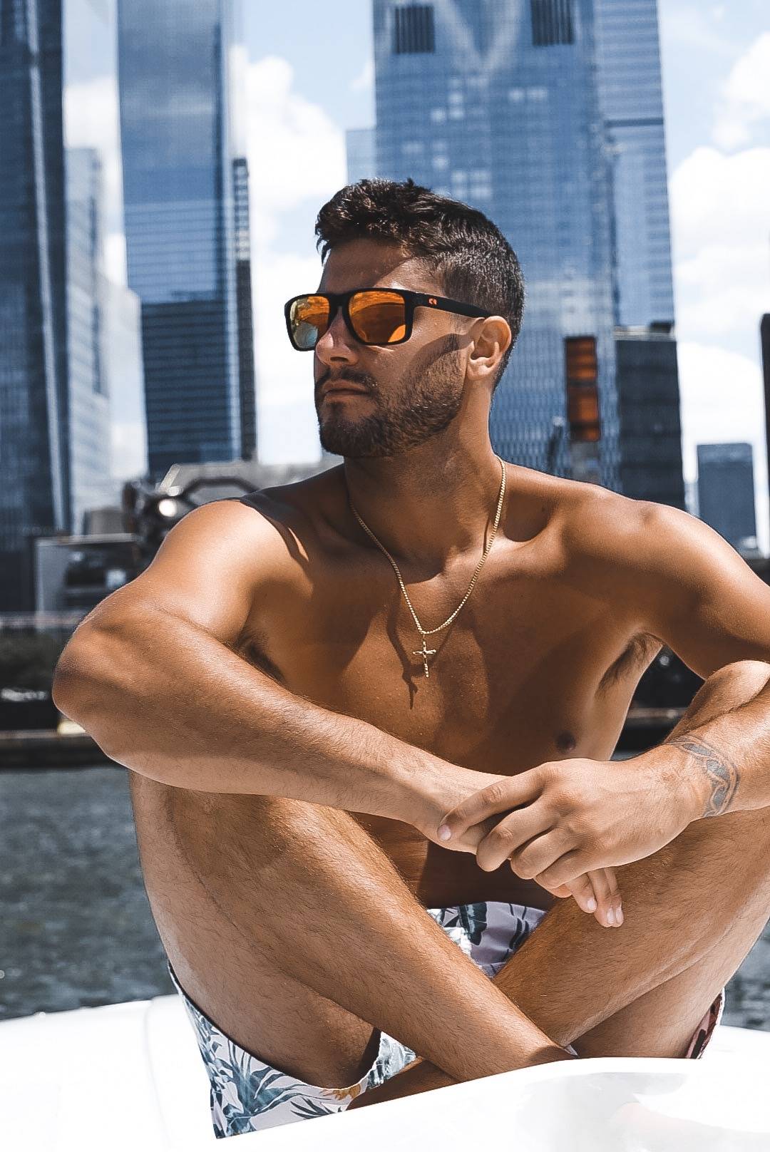 A boater relaxes in New York City with his stylish Rheos shades.