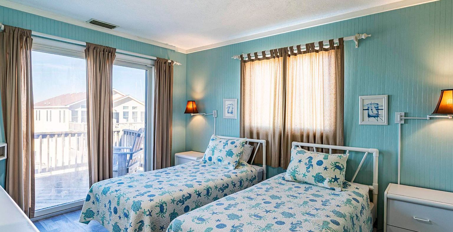 bedroom featuring multiple windows, ornamental molding, and hardwood floors