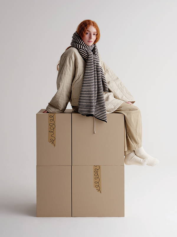 model wears Narrow Stripe Brushed Blanket Scarf Black & Oatmeal