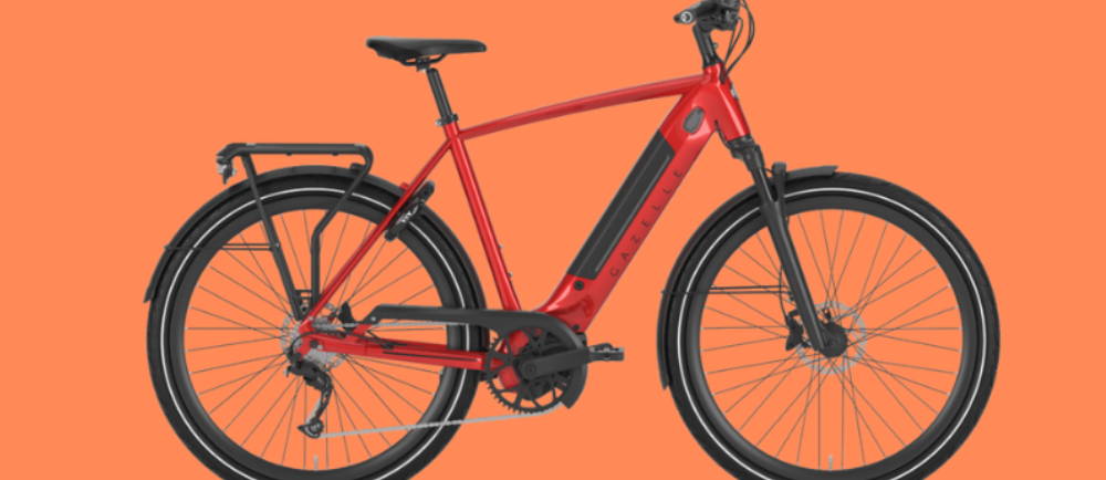 a red Gazelle Ultimate T10+ electric city bike