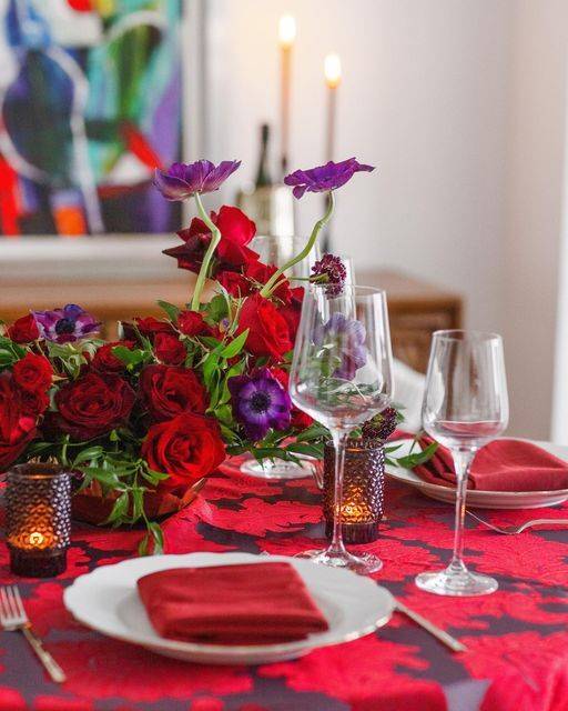 alex damask tablecloth over a table with roses