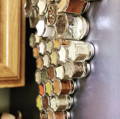 A close up view of magnetic spice jars attached to a metallic surface