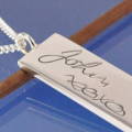 a memorial pendant with handwriting engraved