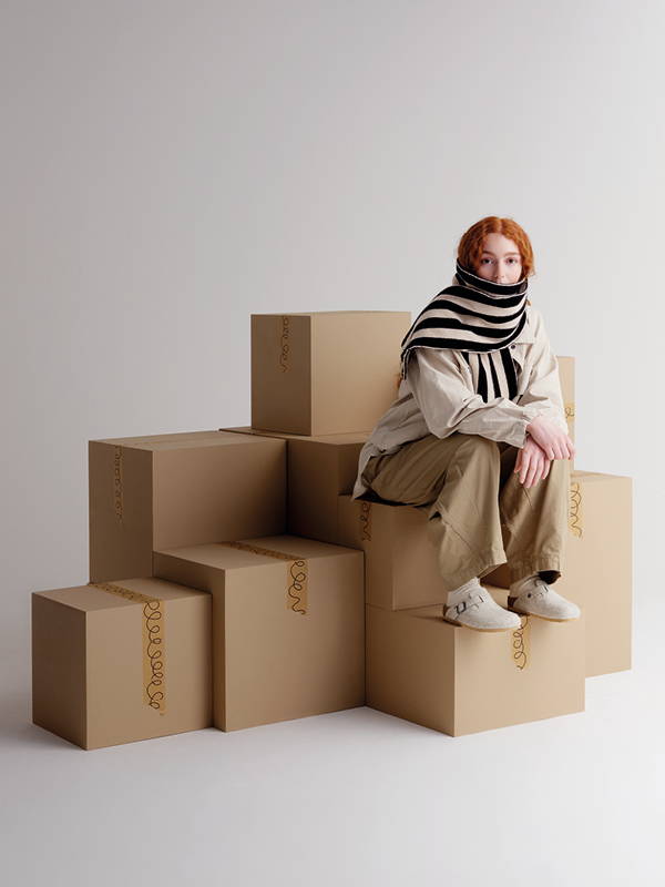 model wears Brushed Vertical Stripe Scarf Black & Oatmeal