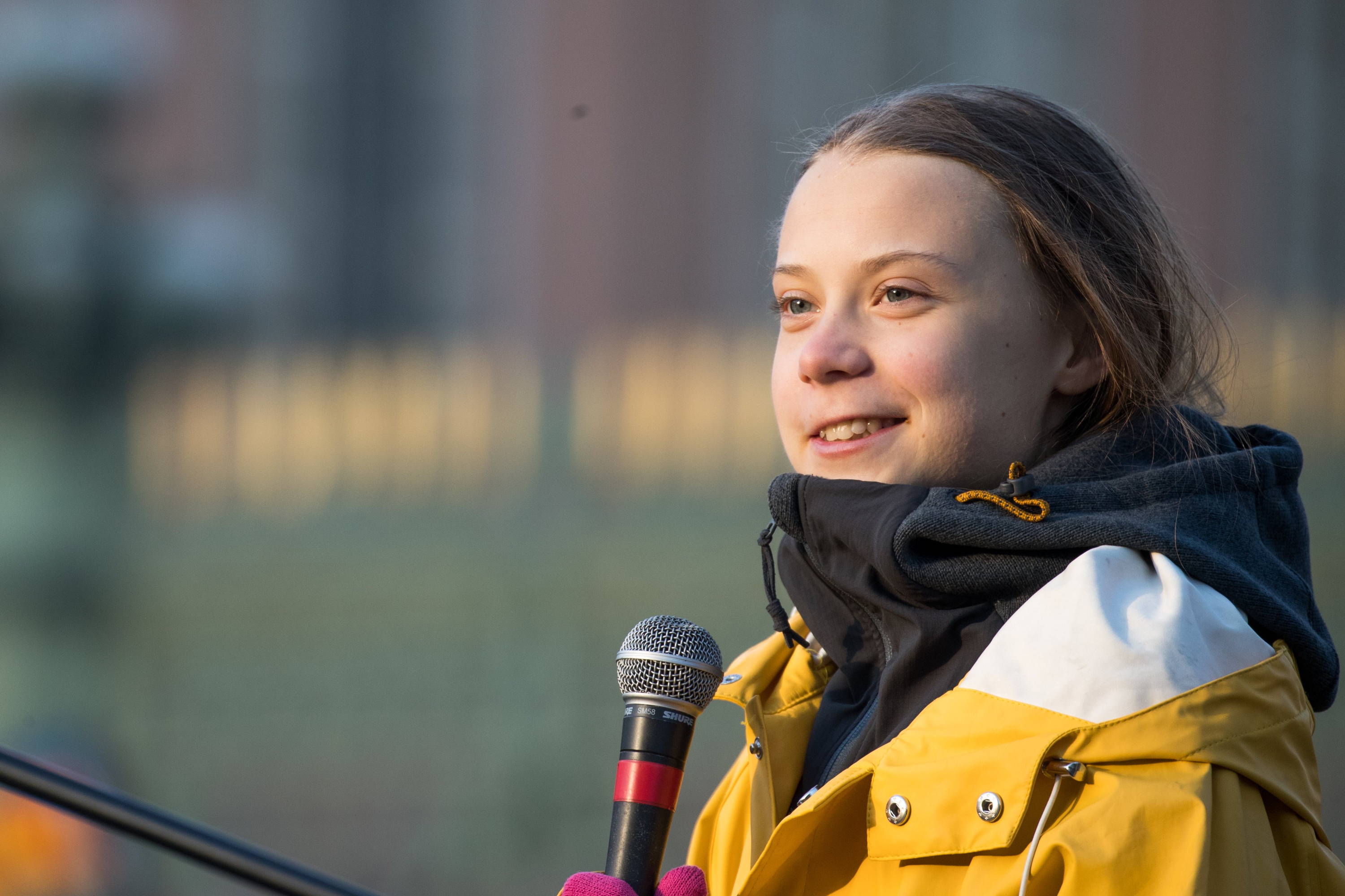 Greta Thunberg wearing a yellow mac