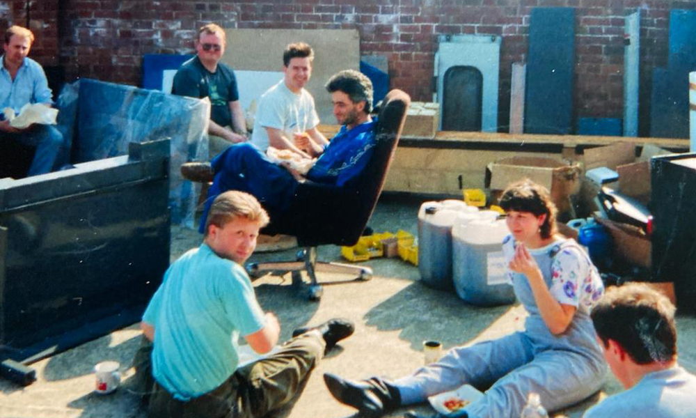 A group of people resting in a work yard