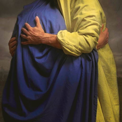 Jesus embracing a person in a blue robe.