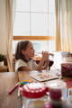 Little girl eating a banana. 