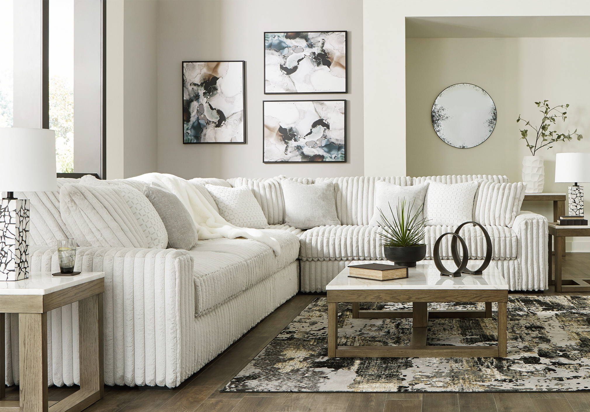 Living room collection, 3 piece white sectional with ottoman in the image, Shop living room button sends you to the in-stock living room collection