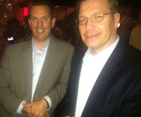 Two drink tickets, no waiting: Vendor parties made up for T3's no-frills vibe. Here, advisors Dan Skiles and Mark Avers of Shareholders Service Group Inc. at the hopping Black Diamond party.