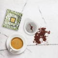 Cialde che diventano Composto - Cialda di carta, polvere di caffè, involucro Arcadia Bio e tazza caffè espresso