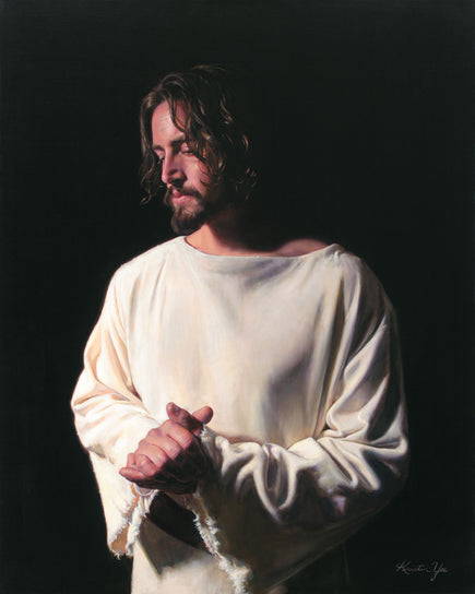 Jesus standing in the dark in a simple robe. He is clasping His hands and has a sorrowful expression.