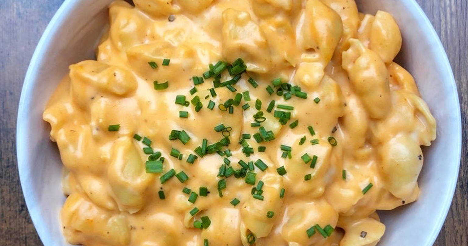 A bowl of mac and cheese with chives