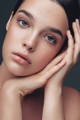 woman looking at her skincare after using products with Goji Berries