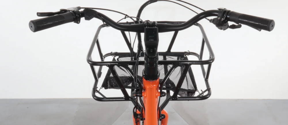 the handlebars on a Yuba Spicy Curry electric cargo bike