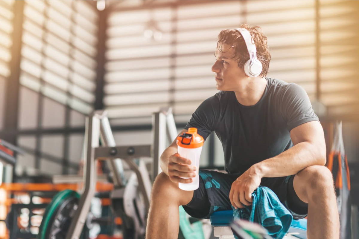 athlete drinking pre-workout at gym