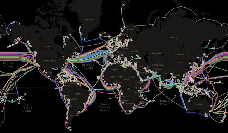 World map with a lot of color lines on it representing undersea cables