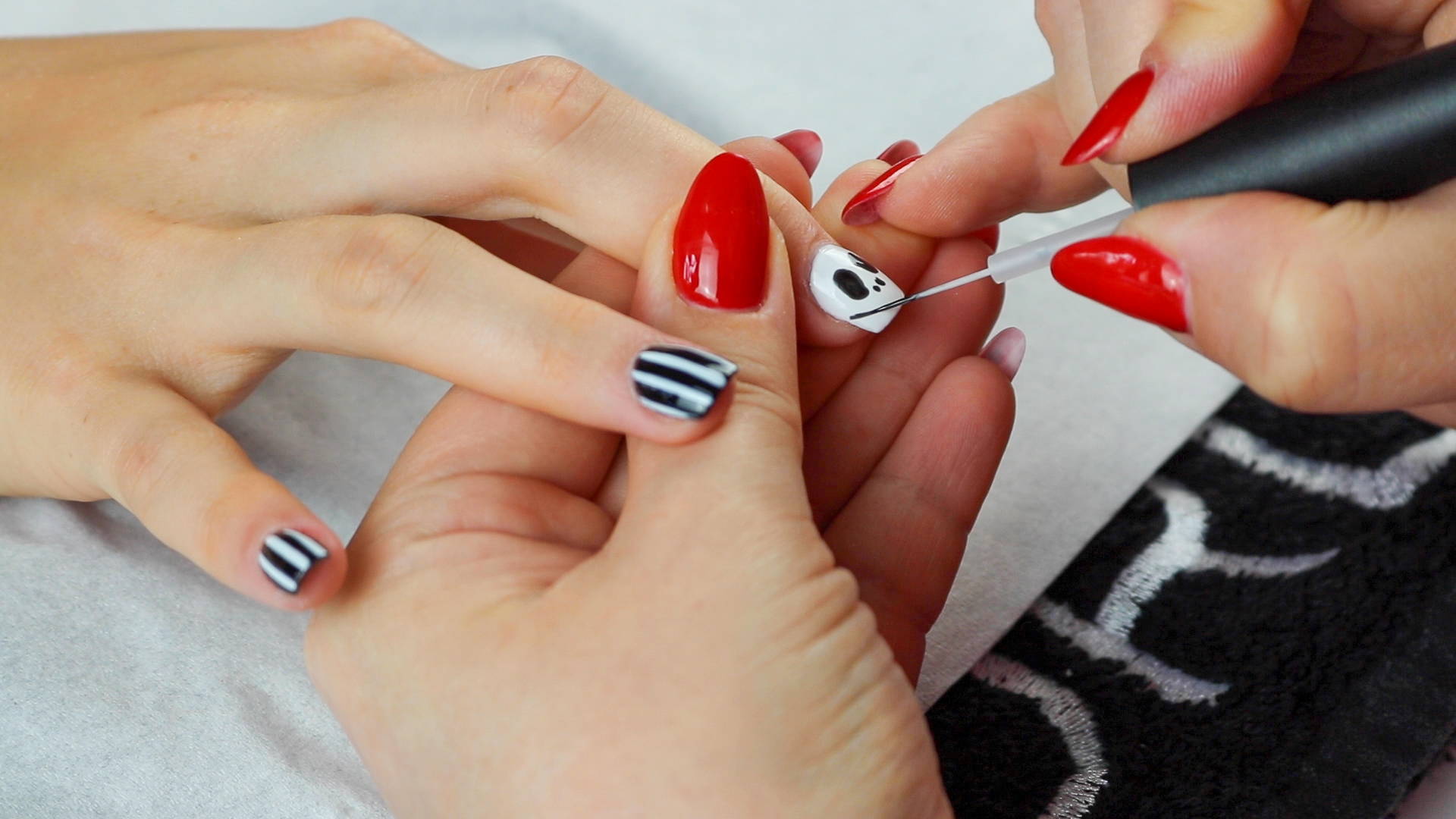 Jack Skellington nails mouth detailing being added to nails using ORLY Liquid Vinyl