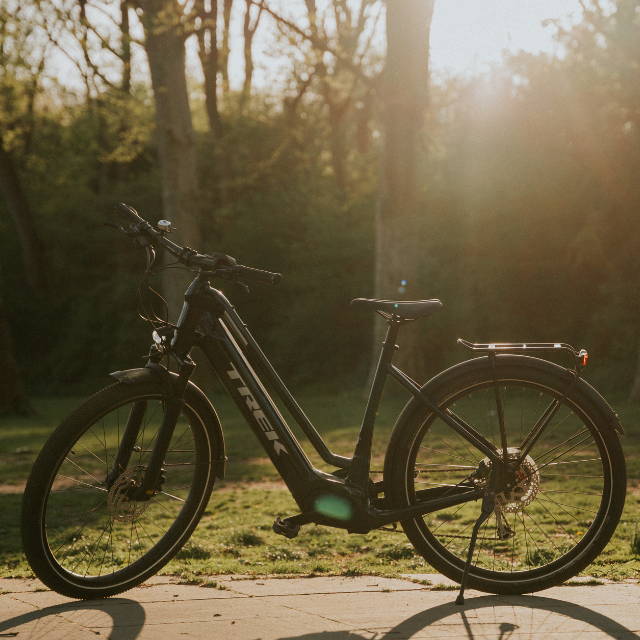 a black Trek Allant elctric commuter bike