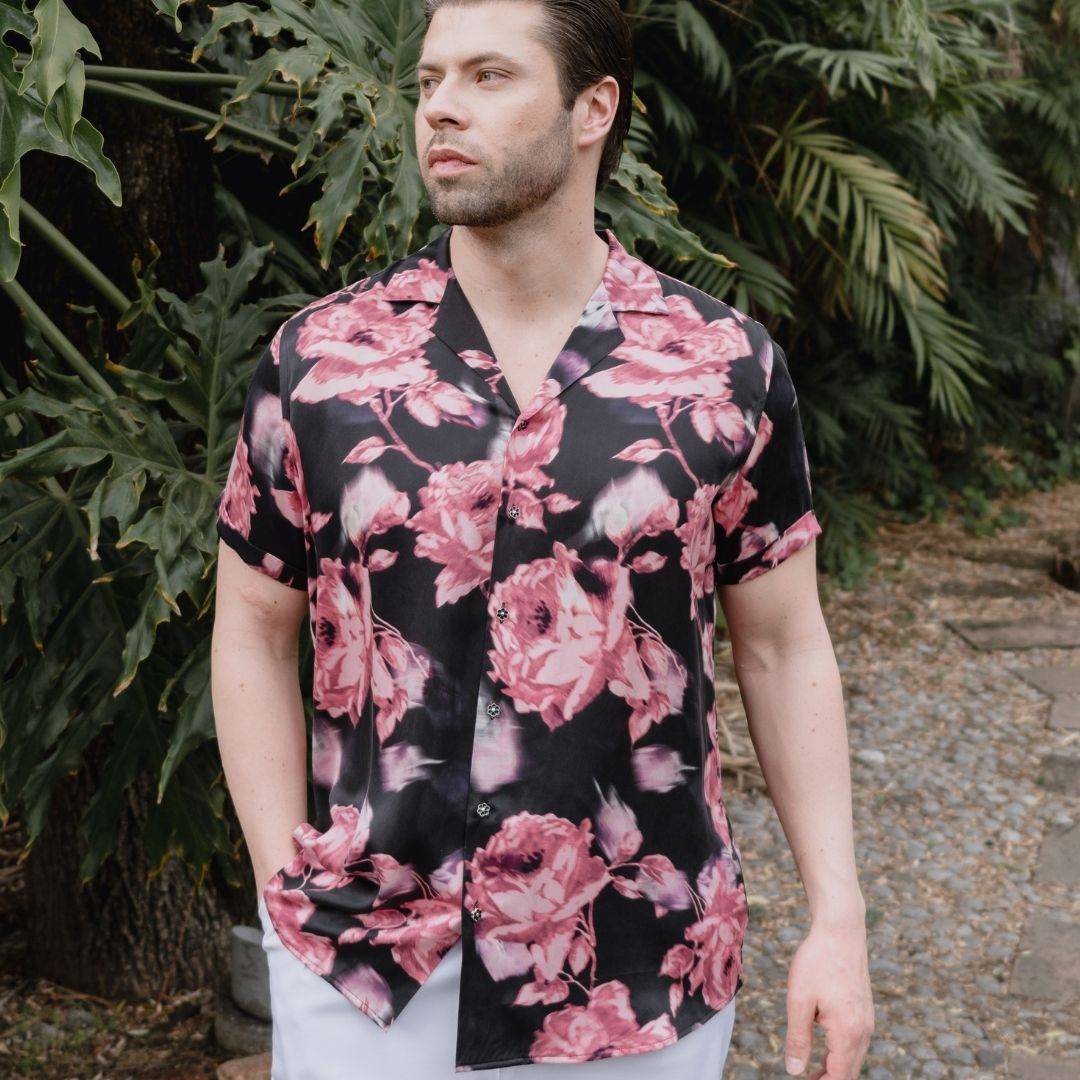 model standing in the garden wearing a black and pink short sleeve silk shirt from 1000 kingdoms
