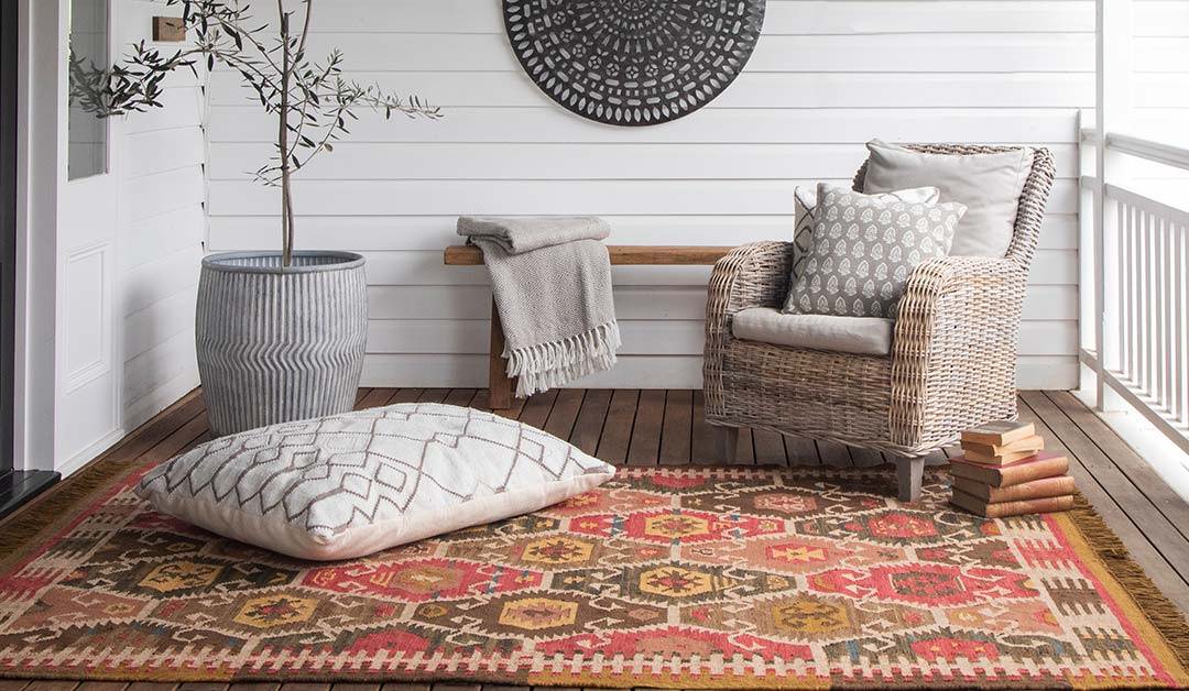 monochrome outdoor floor cushion on a Nomad rug