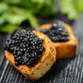 Enjoy Siberian Sturgeon Caviar by Number One Caviar on Toast and Butter