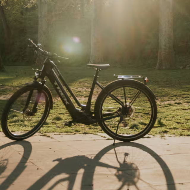a Trek Allant electric city bike in a park