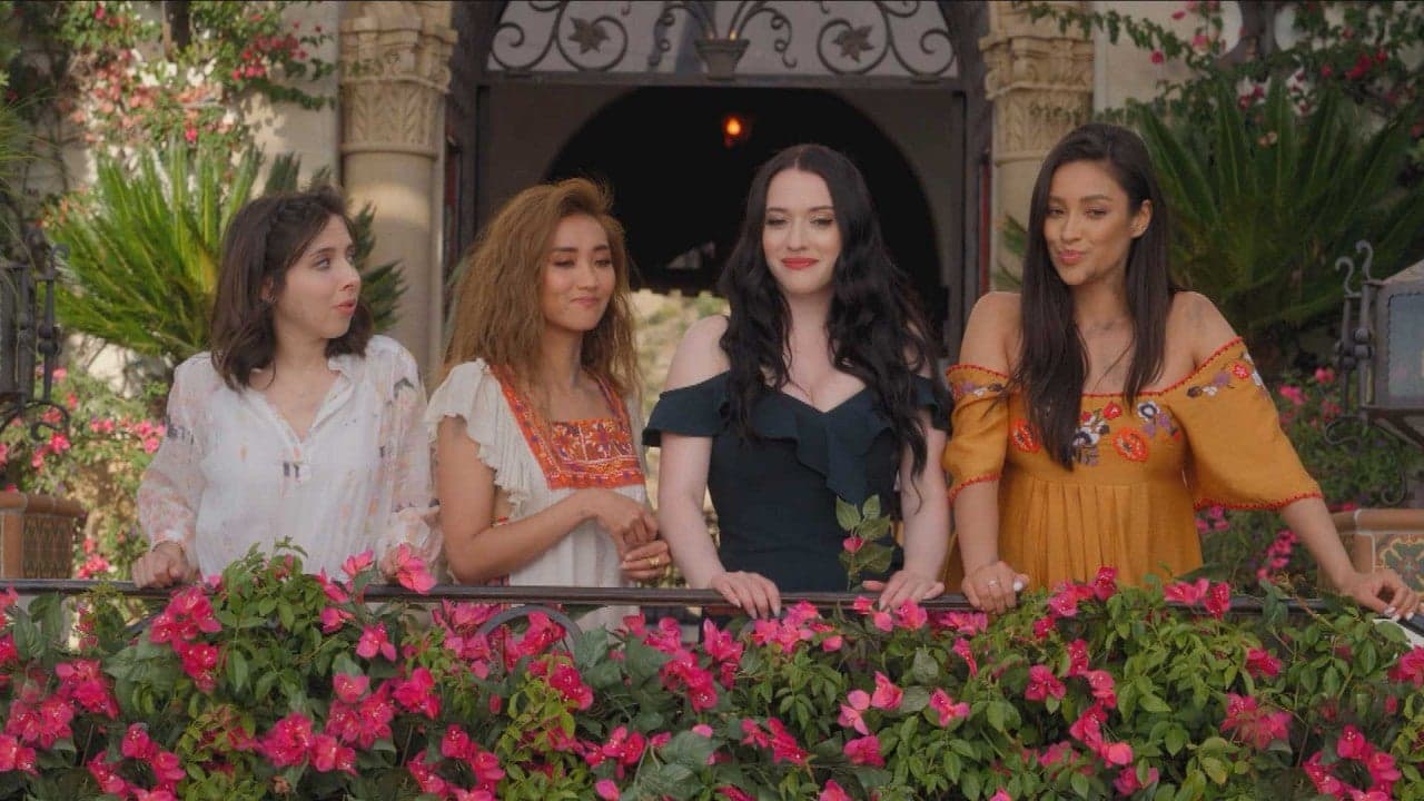 Madison, Jules and Stella standing together at a balcony looking below and smirking.