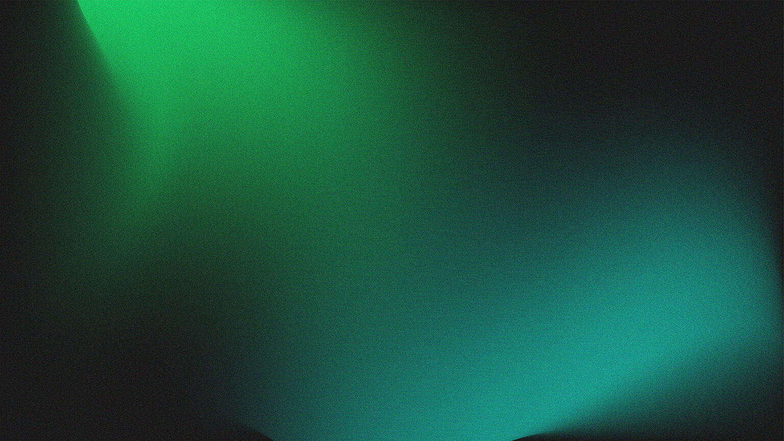 Abstract image with smooth gradients of green and blue light blending together on a dark background, creating a soft, glowing effect from the top left and bottom right corners.